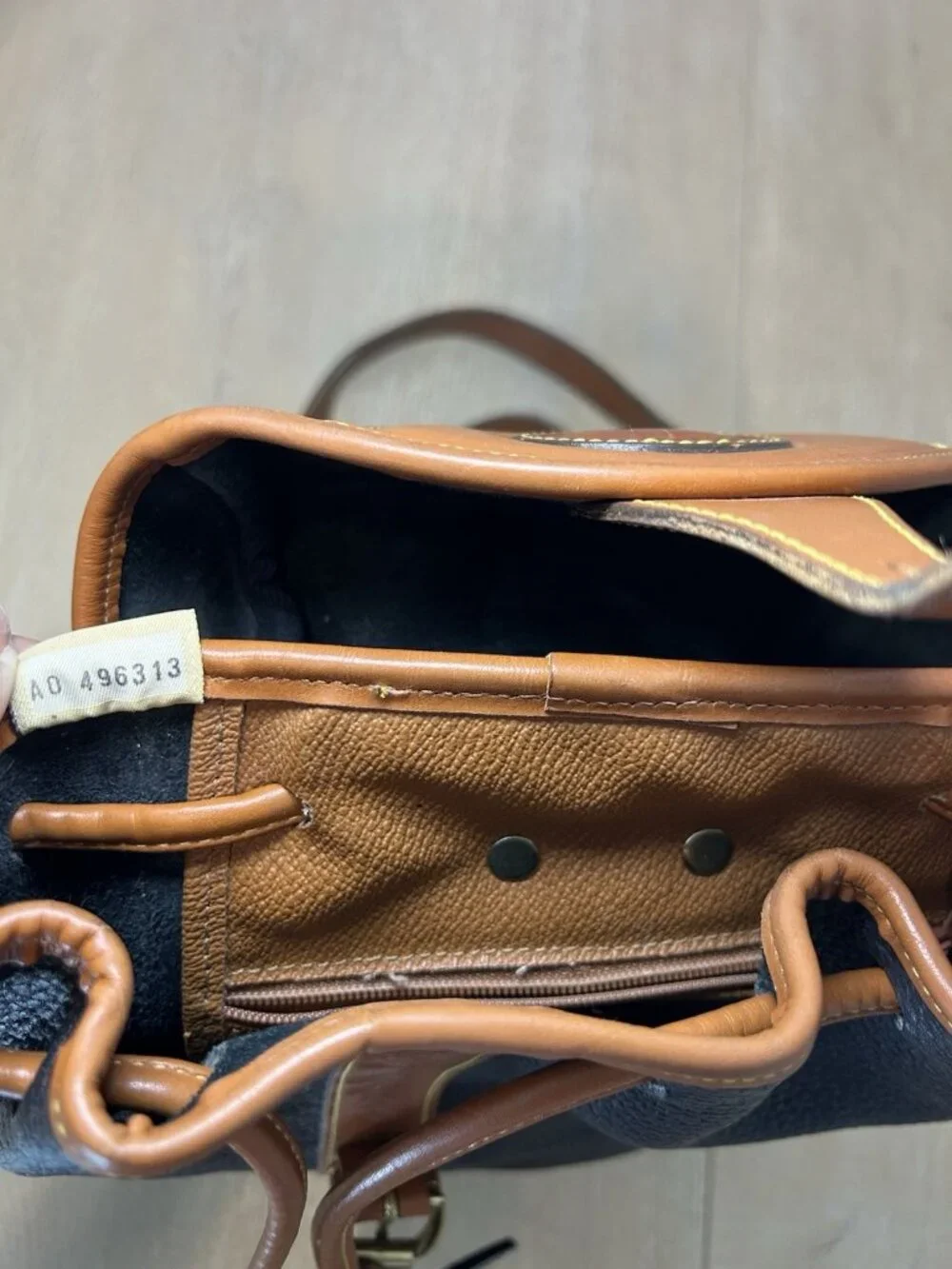 Vintage Dooney & Bourke Black Tan Color All Weather Leather Backpack